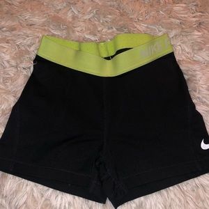 Black nike pro spandex with neon yellow band